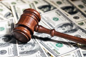 Gavel over pile of cash