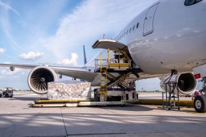 Cargo being loaded on a jet for transportation
