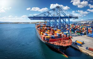 Container ship at port unloading cargo