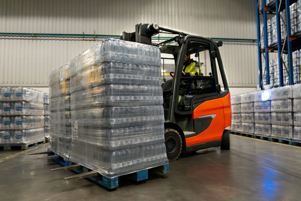 Forklift carring a pallet of water