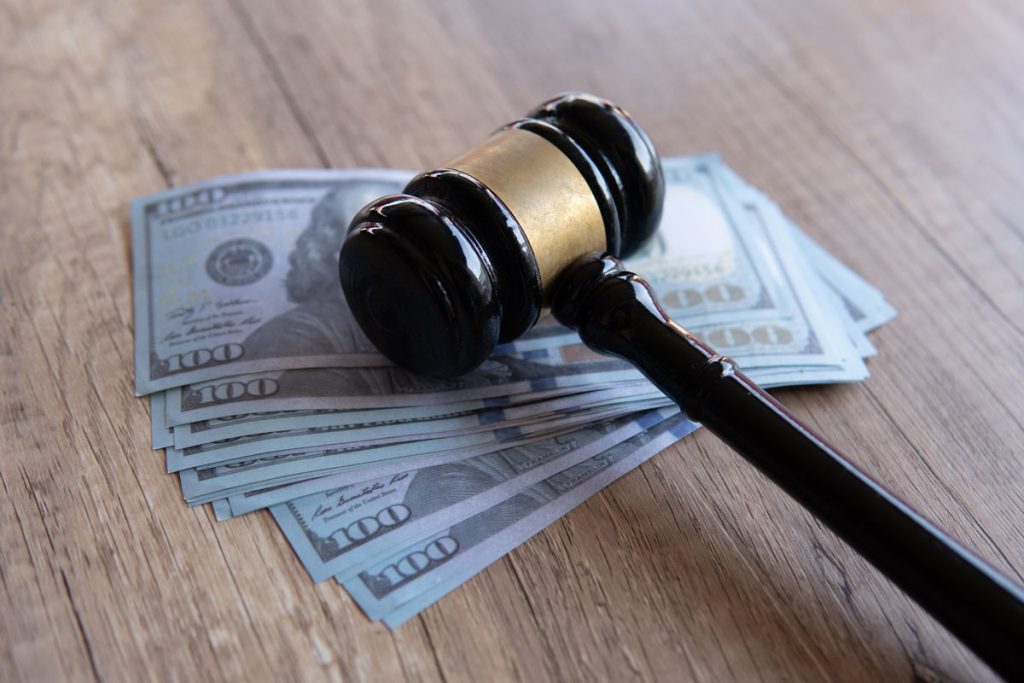 100 bills and a gavel