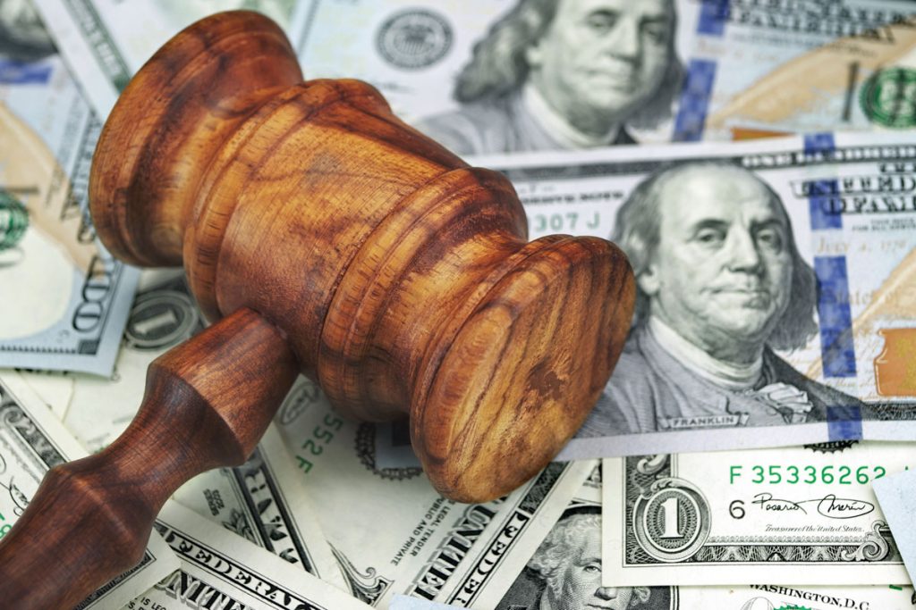 stack of money and a gavel