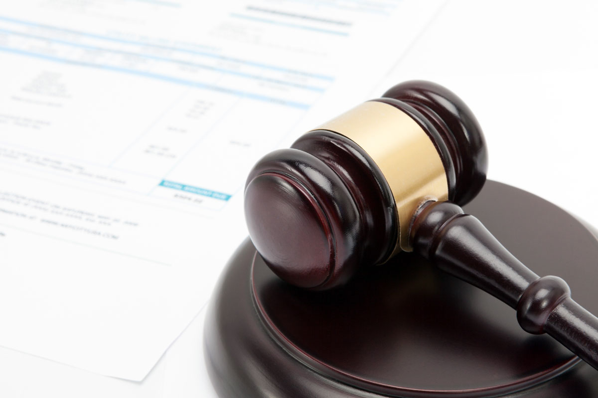 unpaid-invoice-gavel gavel on top of an unpaid invoice